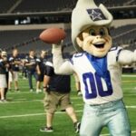 Dallas Cowboys mascot on the field at AT&T Stadium engaging guests—highlighting Arlington DMC fan experiences and entertainment options.