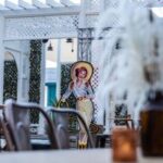 Western-themed event setup in Fort Worth with a vintage cowgirl cutout—styled by the best DMC in Fort Worth for an authentic Texas experience.