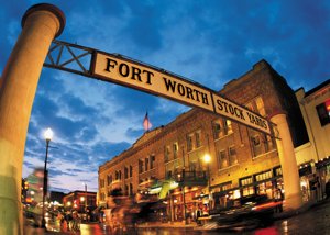 Fort Worth Stockyards sign illuminated at dusk—an iconic venue enhanced by the best DMC in Fort Worth for immersive cultural experiences.