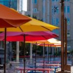 Colorful outdoor umbrellas and casual seating in downtown Fort Worth—perfect for relaxed events coordinated by the best DMC in Fort Worth.
